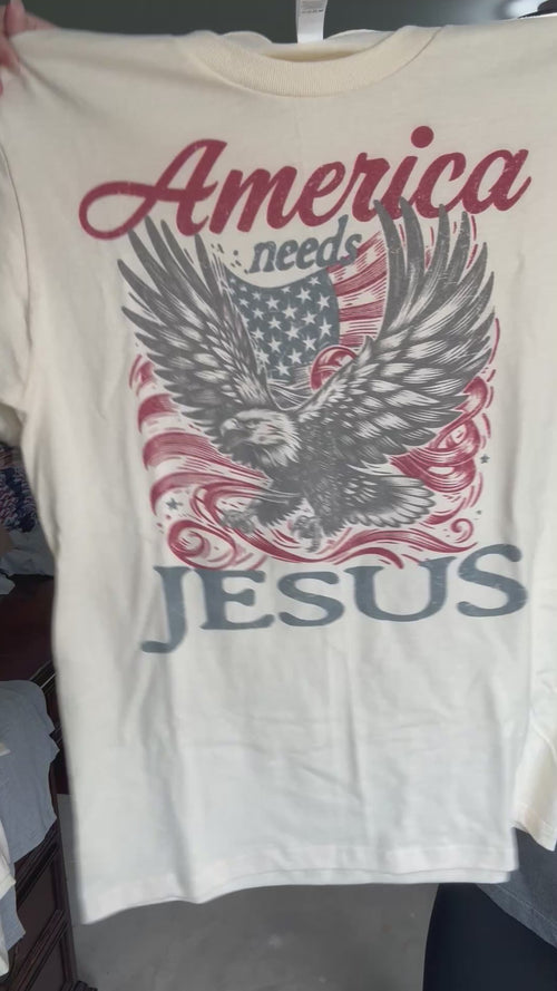 video of shirt waving that says america needs jesus